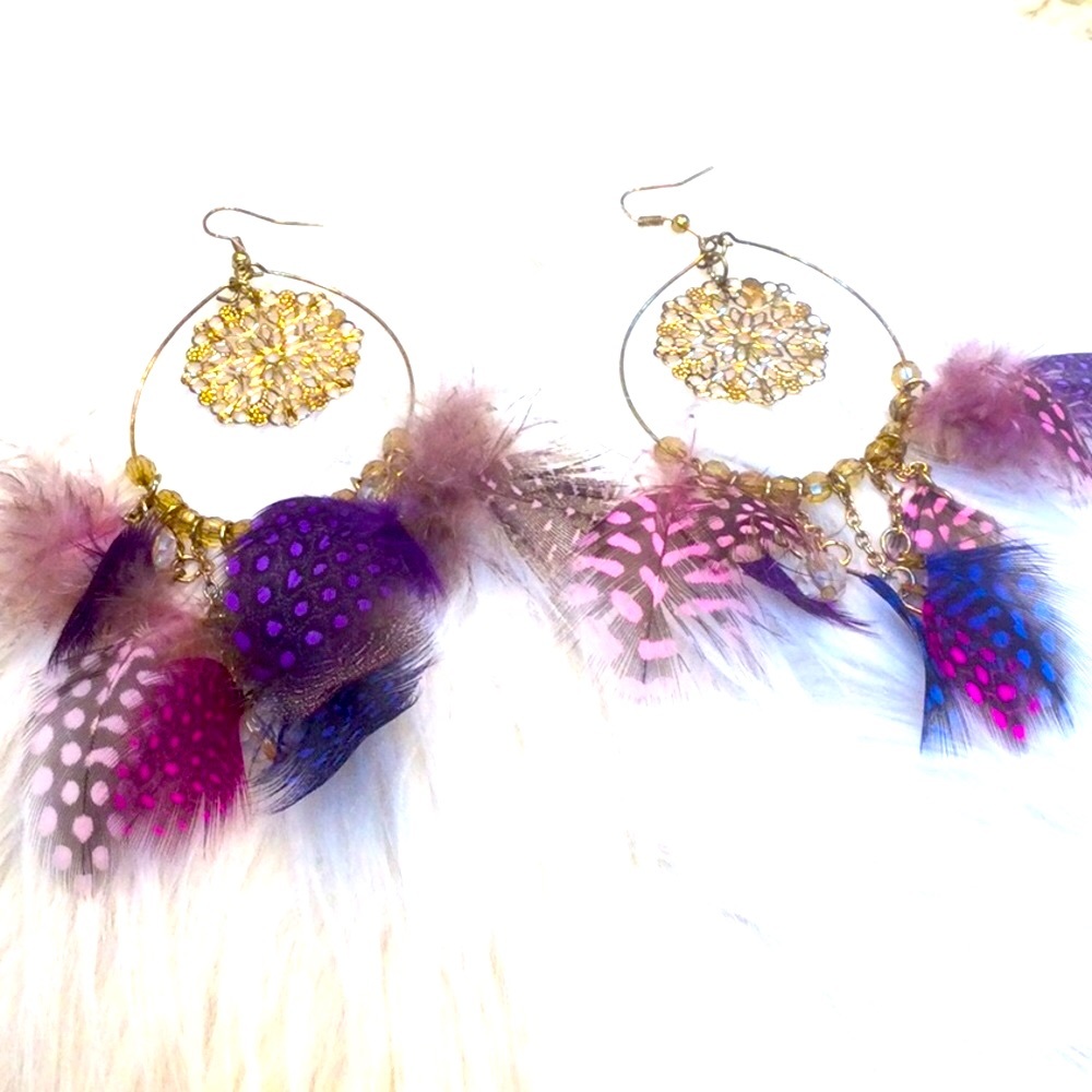 - - Striking feathered earrings